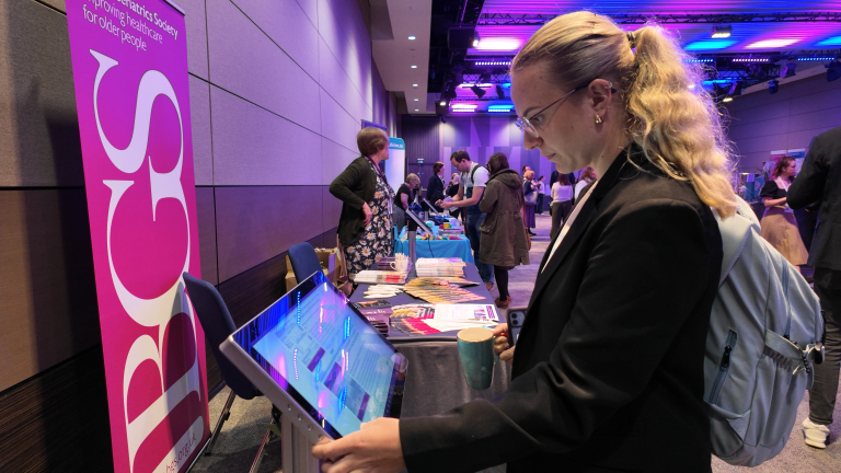 Conference attendee browsing posters