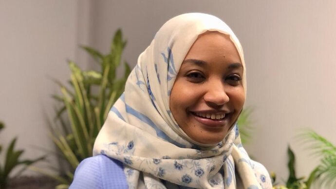 pharmacist wearing hijab smiling 