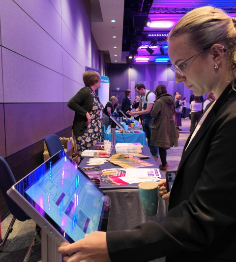 Conference attendee browsing posters